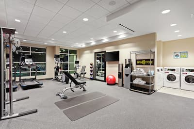 Fitness Center with Weight Bench, Treadmill and Weight Machine