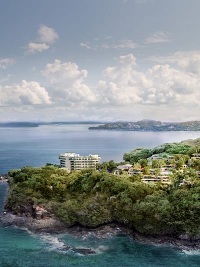 View of property showing buildings, trees and coastline